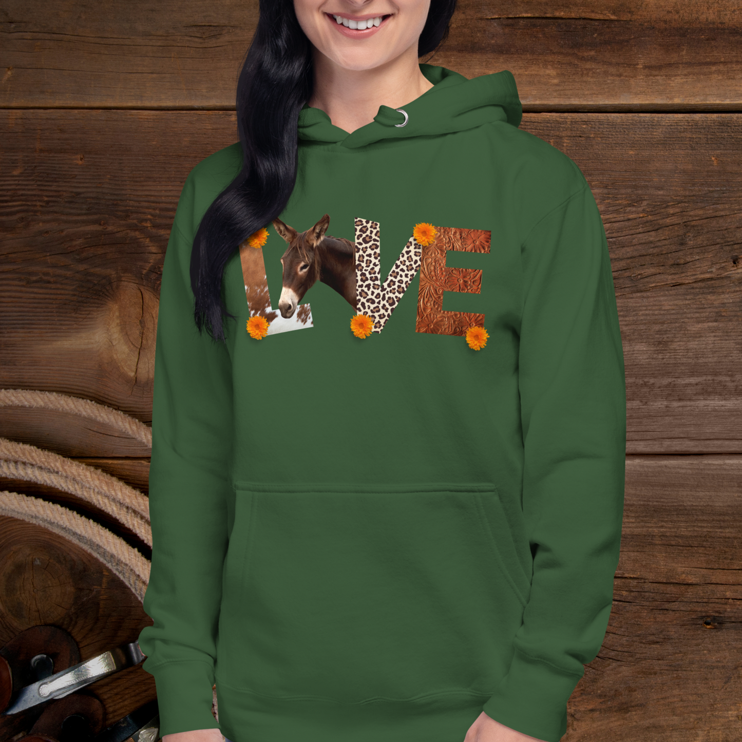 Forest green pull over hoodie sweatshirt with has  the word Love spelled out with cow hide  as the L , a donkey as the O, Leopard print and the V and tooled leather as the E