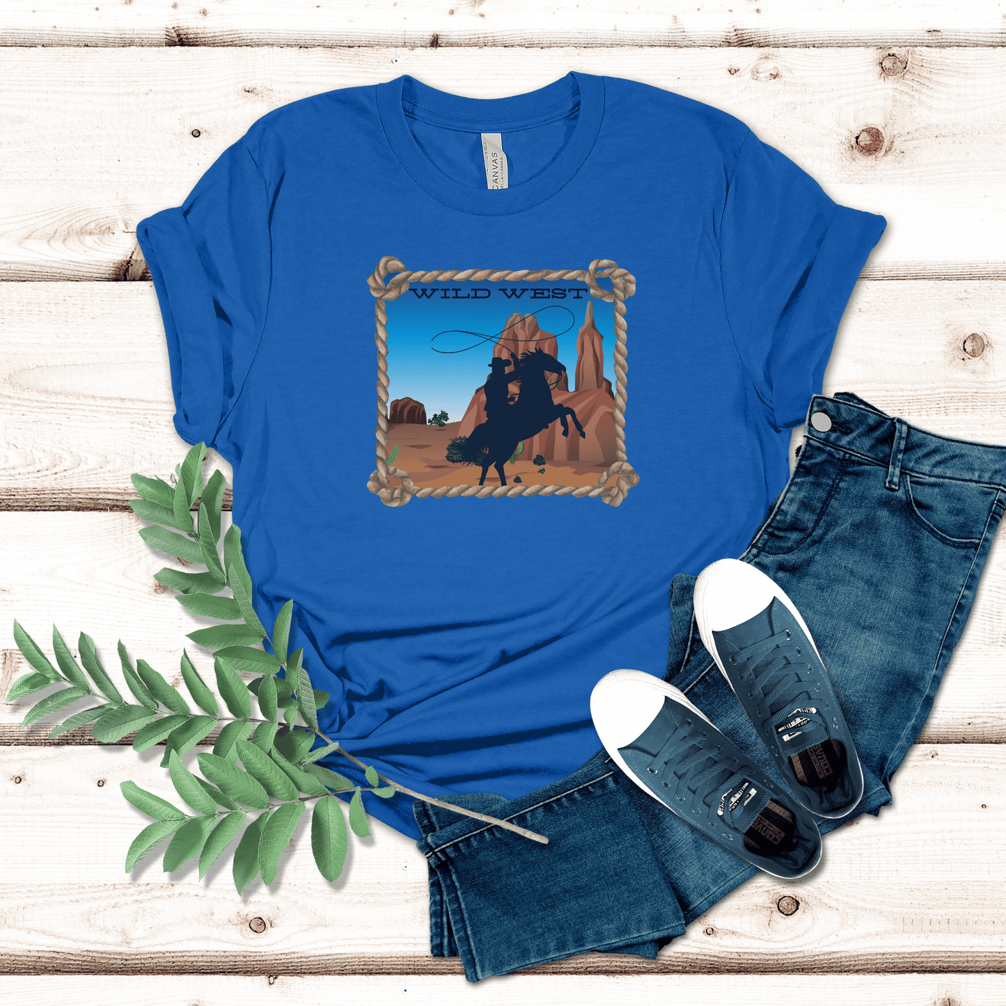 True Royal colored tee with a wild west desert scene  with a rearing horse and cowboy