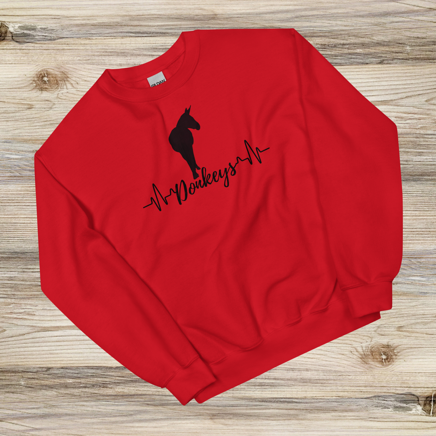 a heartbeat design with a silhouette of a donkey on a red crew neck sweatshirt