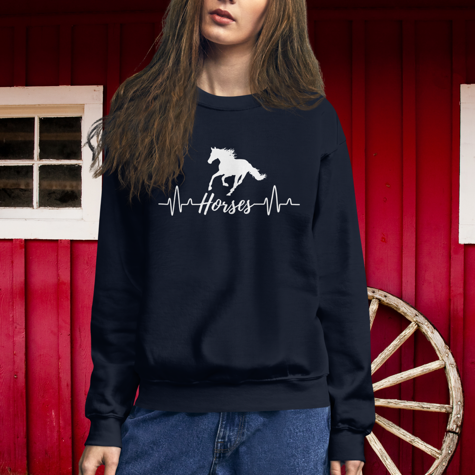 Silhouette of a horse with a heartbeat design with the word horses in the heartbeat .The design is all white printed on a Navy sweatshirt.