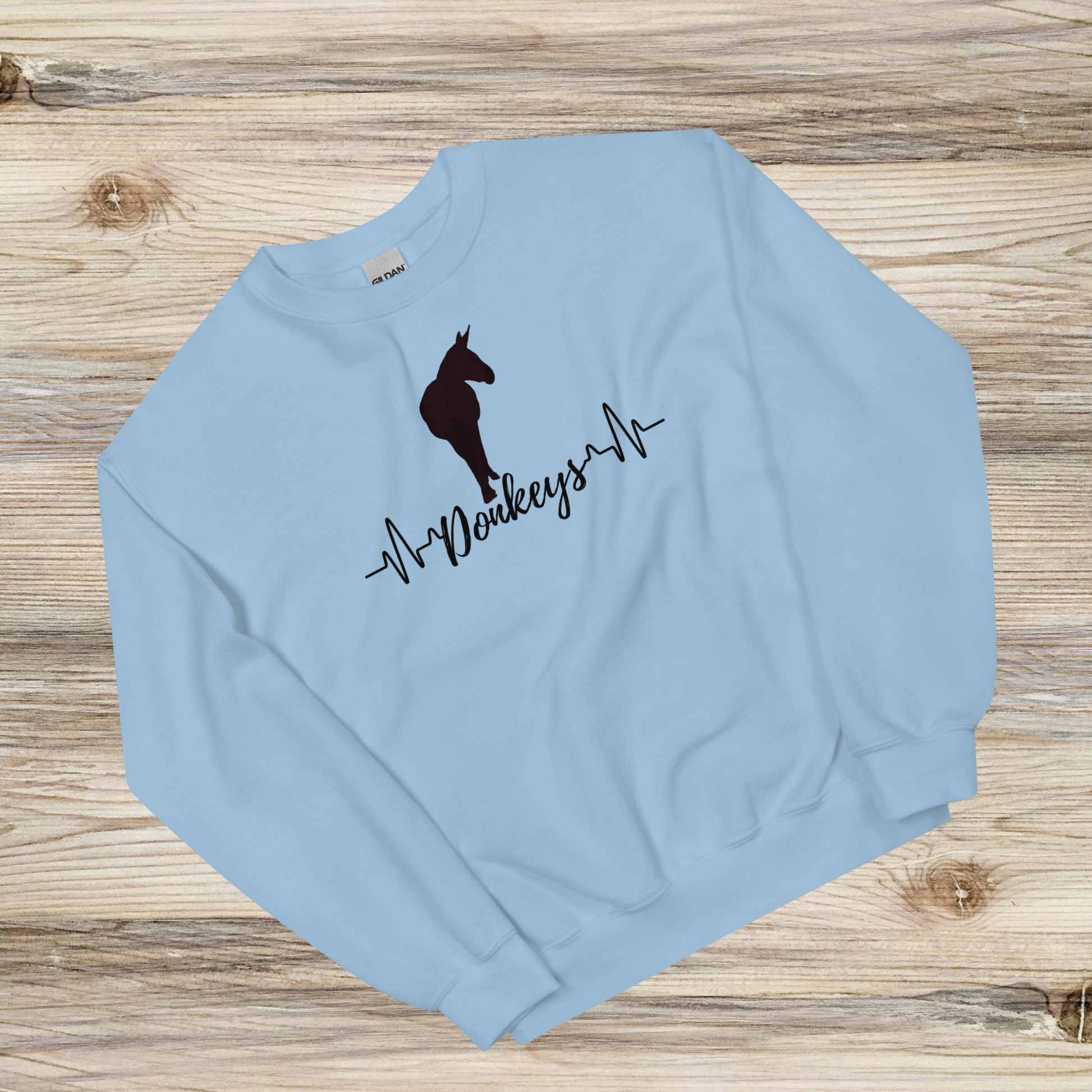 a heartbeat design with a silhouette of a donkey on a light blue crew neck sweatshirt