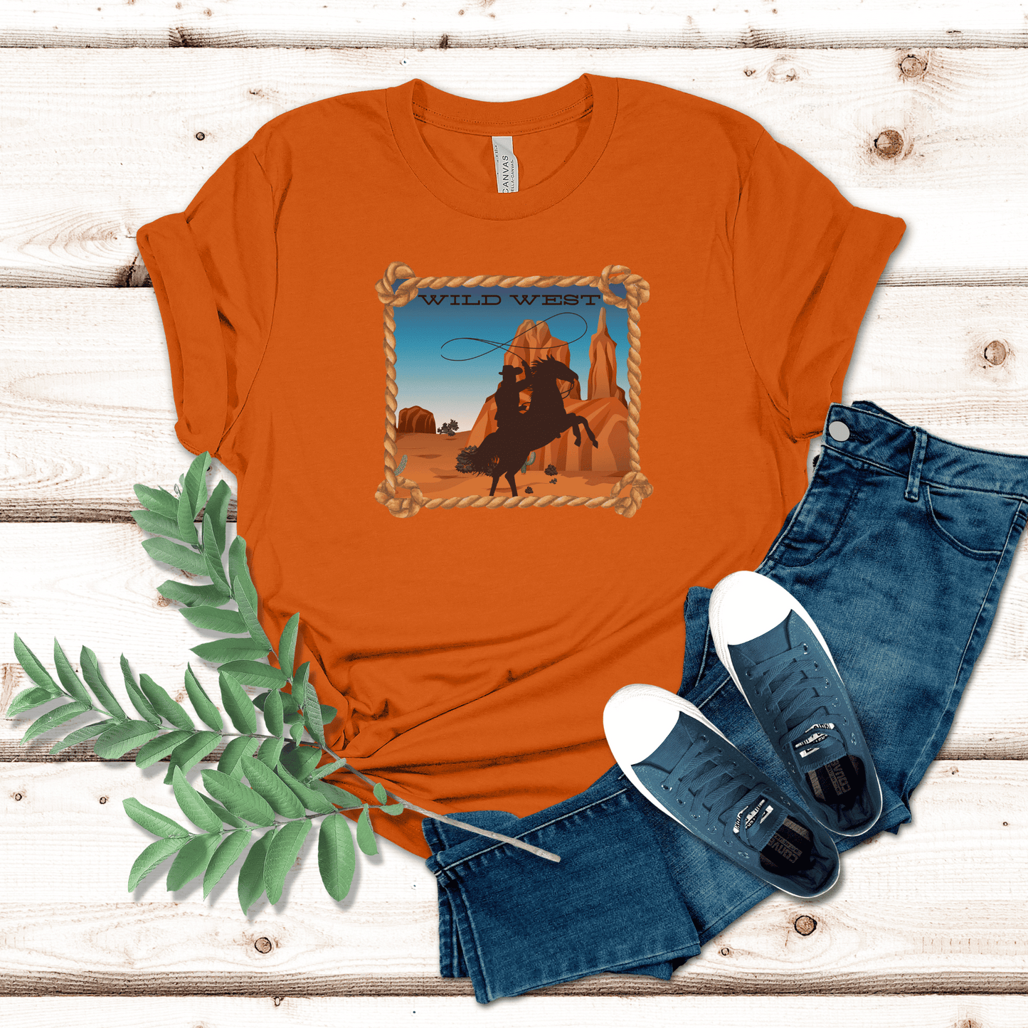 Autumn colored tee with a wild west desert scene  with a rearing horse and cowboy