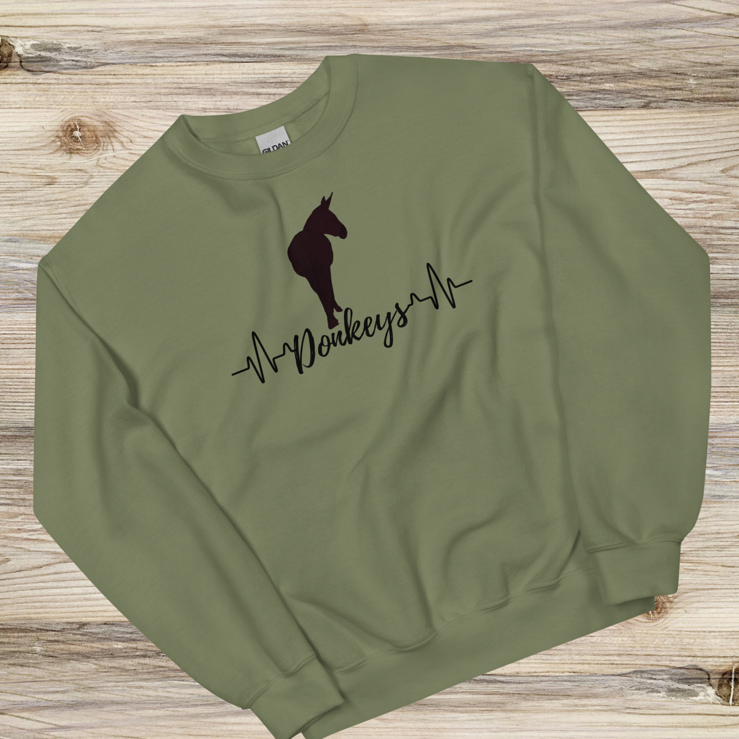 a heartbeat design with a silhouette of a donkey on a military green crew neck sweatshirt